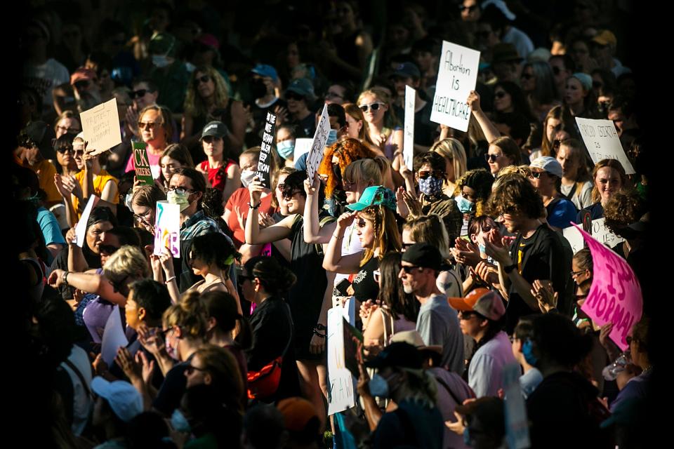 Hundreds of abortion-rights protesters demonstrate following the Supreme Court's decision to overturn Roe v. Wade, Friday, June 24, 2022, in Iowa City, Iowa.