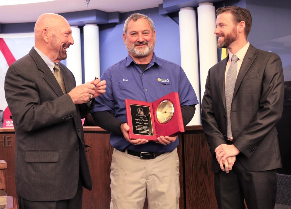 Tony Rosen, an Electrical Maintenance Technician with Public Works, is named the City of Venice 2021 Employee of the Year by City Manager Ed Lavallee during Tuesday's Council meeting, as Assistant City Manager James Clinch looks on.