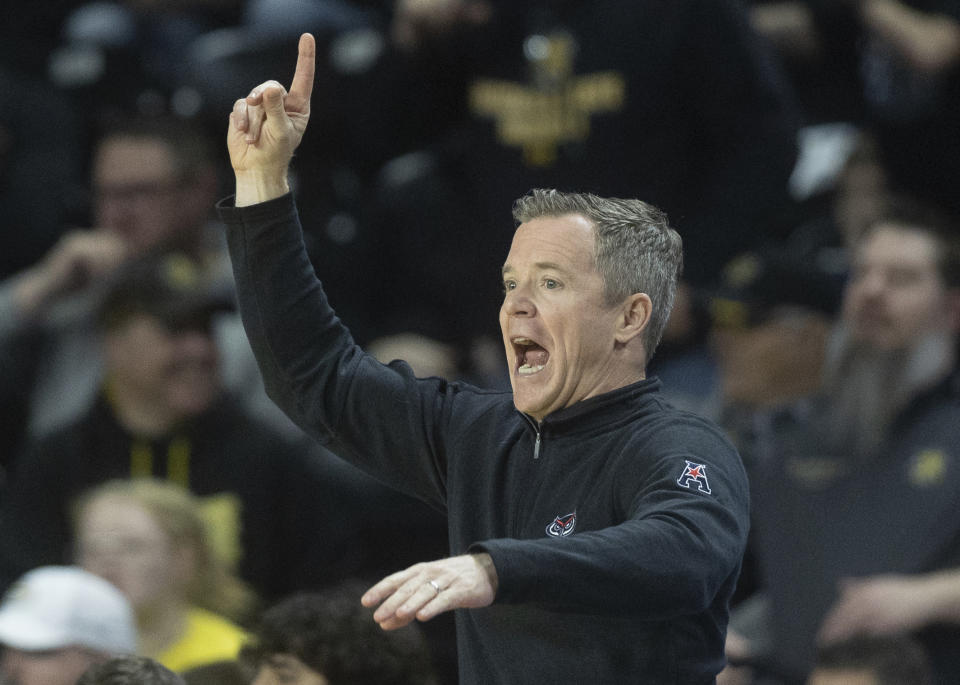 Florida Atlantic coach Dusty May yells instruction to his team during the first half of an NCAA college basketball game against Wichita State on Sunday, Feb., 11, 2024, in Wichita, Kan. (Travis Heying/The Wichita Eagle via AP)