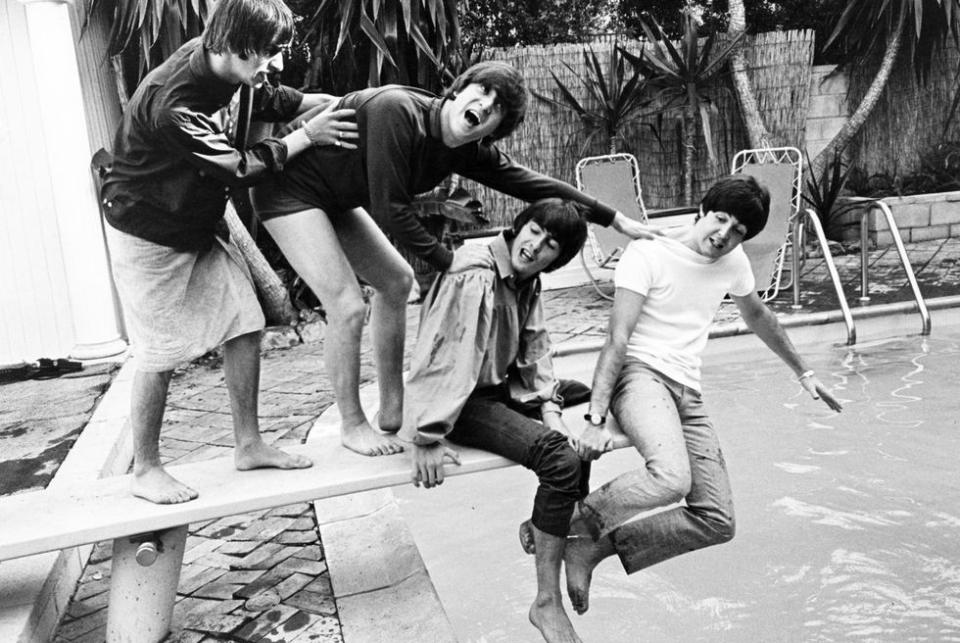 <p>The Beatles clown around in the pool at their Hollywood Hills hideout during their first U.S. and Canada tour in 1964.</p>