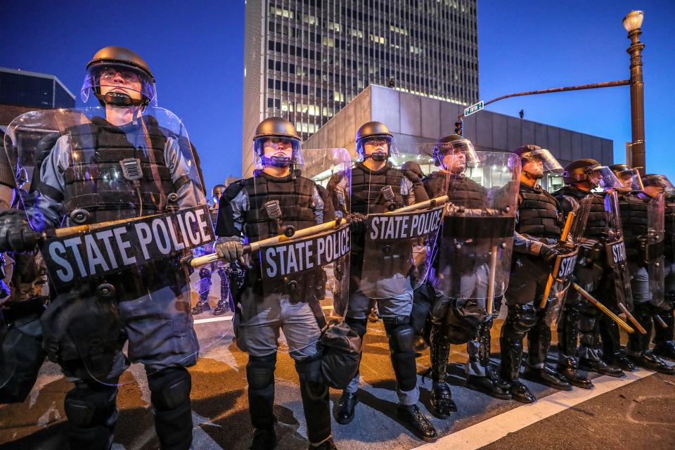 Kentucky State Police were called into Louisville, Ky., during racial justice demonstrations in the summer of 2020 and squared off against protesters on Fifth Street.