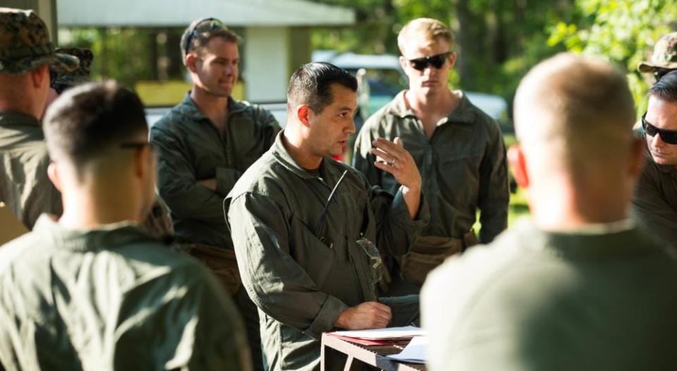 Marine Corps Master Sgt. Carlos Villarreal, an Explosive Ordnance Disposal (EOD) technician, delivers a safety brief before an EOD practice event at Marine Corps Air Station (MCAS) Cherry Point, North Carolina, Aug. 12, 2021