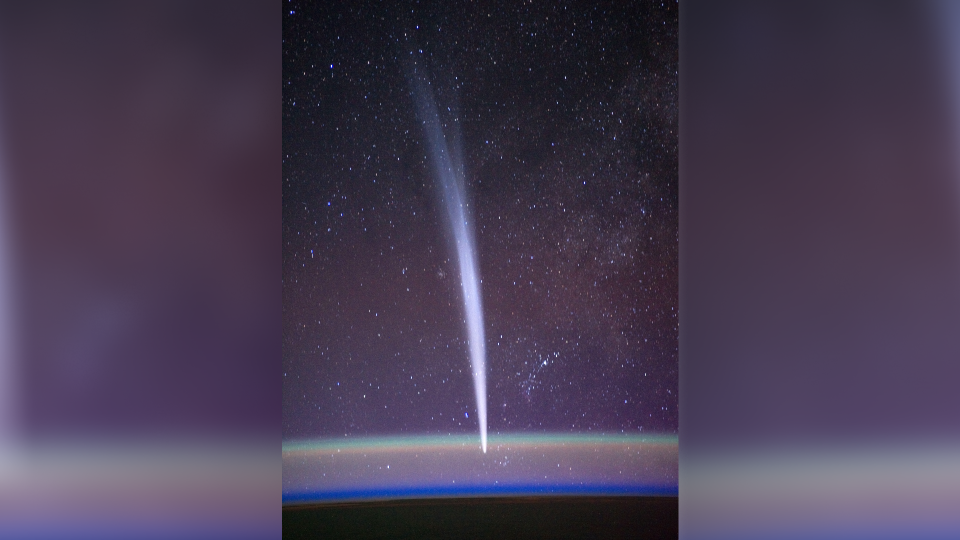 a bright, hazy streak can be seen from top to bottom in a photograph of the starry sky