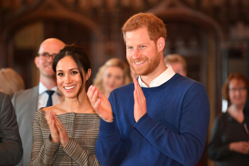 Prince Harry and Meghan Markle watch a performance during their visit to Cardiff Castle on January 18, 2018 in Cardiff, Wales.