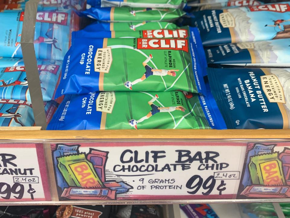 stacks of clif bars on the shelves at trader joes