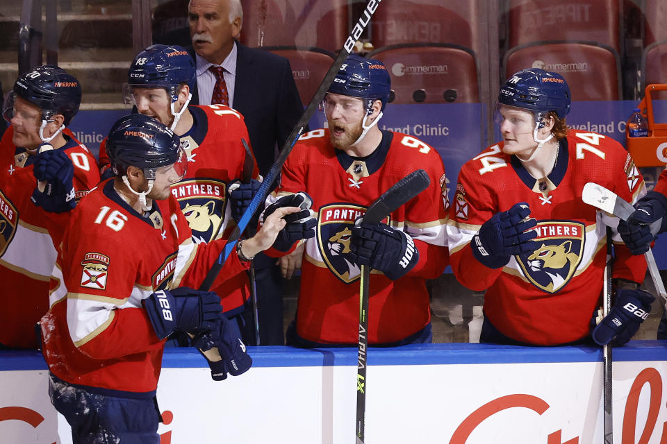 SUNRISE, FL - OCTOBER 16: Teammates congratulate Aleksander Barkov #16 of the Florida Panthers after he scored a third period goal against the New York Islanders at the FLA Live Arena on October 16, 2021 in Sunrise, Florida. (Photo by Joel Auerbach/Getty Images)