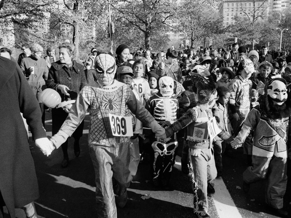 halloween vintage parade with children dressed as Spiderman