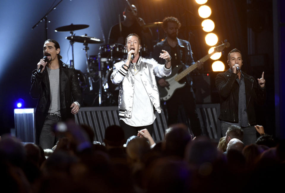 Tyler Hubbard, center, of Florida Georgia Line, Kevin Richardson, left, and Howie Dorough, right, of Backstreet Boys, perform at the 52nd annual Academy of Country Music Awards at the T-Mobile Arena on Sunday, April 2, 2017, in Las Vegas. (Photo by Chris Pizzello/Invision/AP)