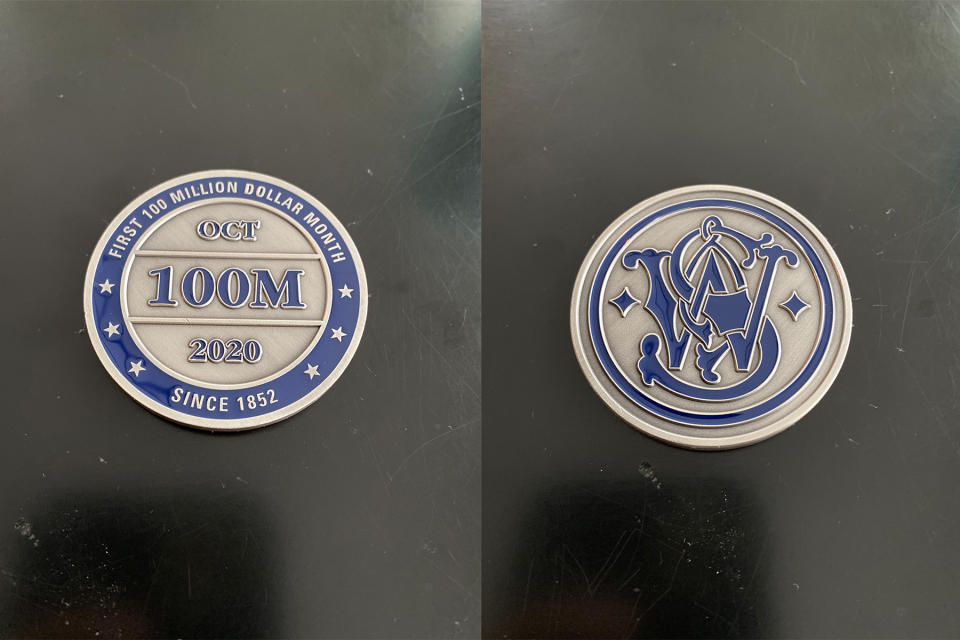 Photos of the coin given out by Smith & Wesson to celebrate sales in late 2020, provided by a former employee.