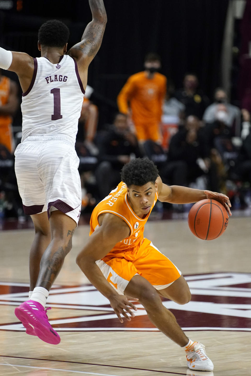 Tennessee guard Jaden Springer (11) drives past Texas A&M guard Savion Flagg (1) during the second half of an NCAA college basketball game Saturday, Jan. 9, 2021, in College Station, Texas. (AP Photo/Sam Craft)