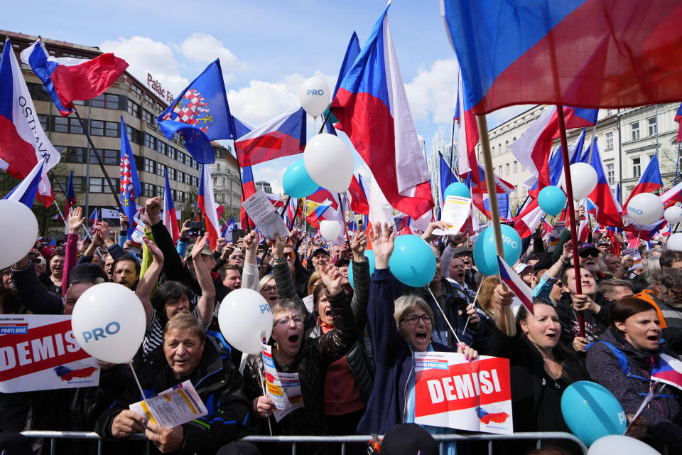 People shout slogans as thousands of people gather to protest high inflation and to demand the government's resignation in Prague, Czech Republic, Sunday, April 16, 2023. (AP Photo/Petr David Josek)