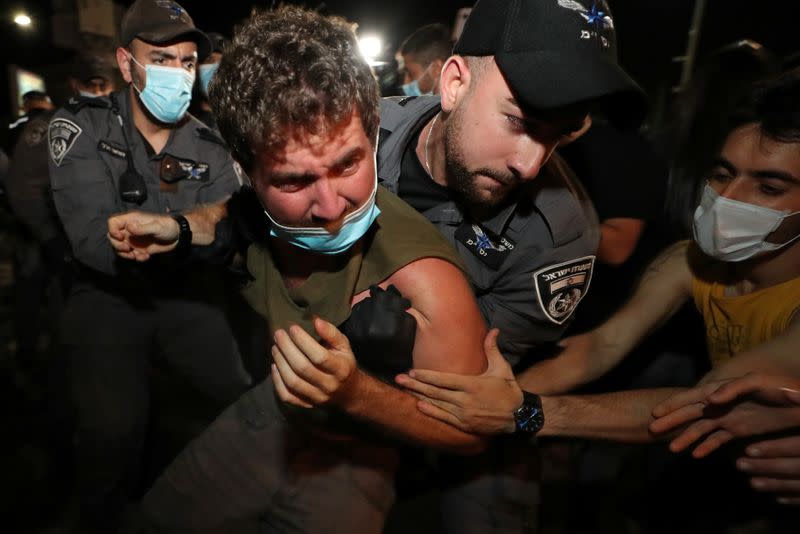 Israelis protest against law that limits protests during the coronavirus disease (COVID-19) lockdown, in Tel Aviv