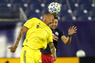 Nashville SC forward Jhonder Cadiz, left, and New England Revolution defender Matt Polster head the ball during the second half of an MLS soccer match Friday, Oct. 23, 2020, in Nashville, Tenn. (AP Photo/Mark Humphrey)