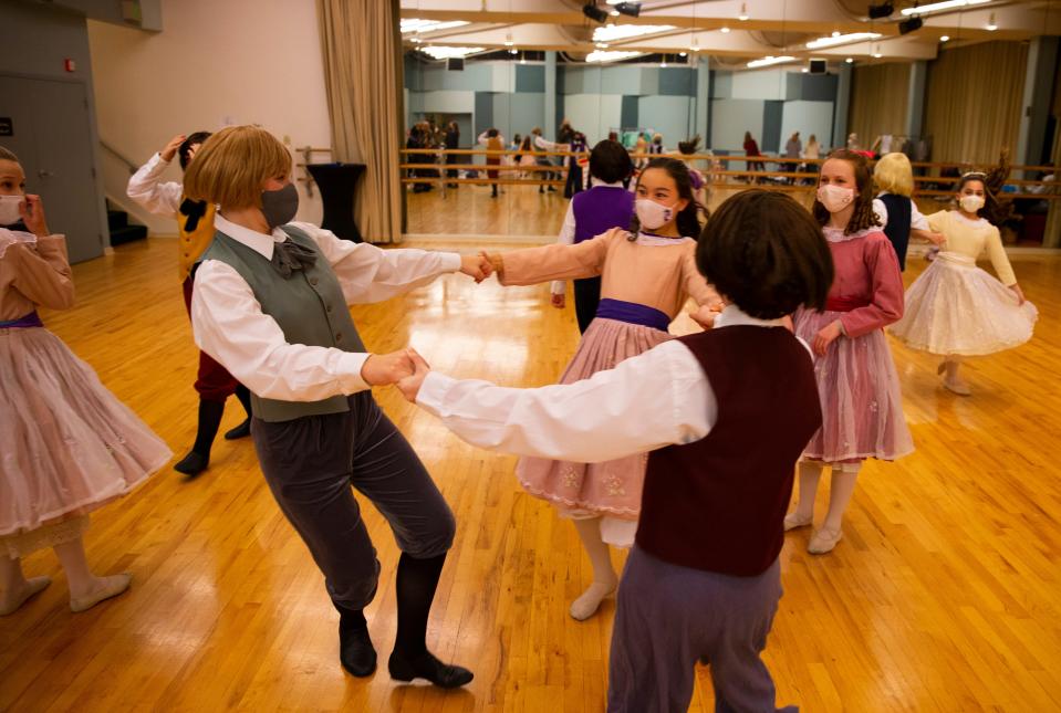 Dancers with the Eugene Ballet Academy warm up backstage before Thursday rehearsal for "The Nutcracker" at the Hult Center.