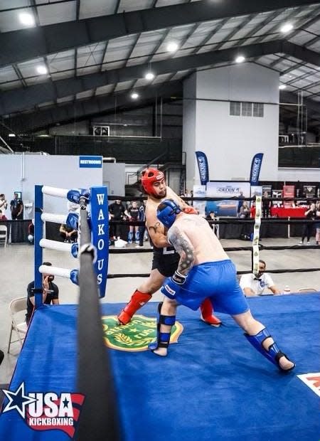 Former Manual High School wrestling star Cody Baker competes in a WAKO kickboxing bout on his way to a place with Team USA's roster.