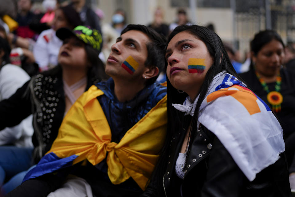 Supporters of new President Gustavo Petro attend his swearing-in ceremony at the Bolivar square in Bogota, Colombia, Sunday, Aug. 7, 2022. (AP Photo/Ariana Cubillos)