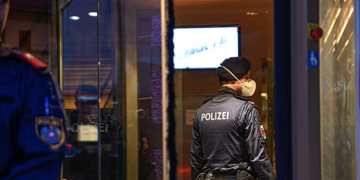 Policeman with respirator mask in Grand Hotel Europa in Austria