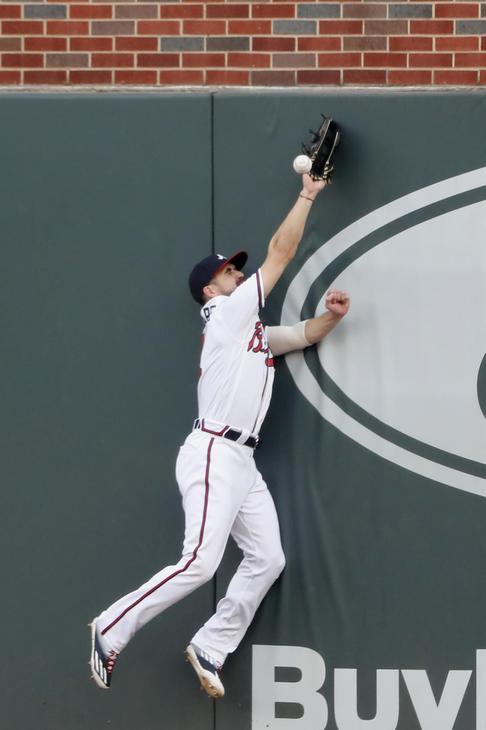 Atlanta Braves center fielder Ender Inciarte (11) can't reach a ball hit for a double by Toronto Blue Jays' Vladimir Guerrero Jr. in the second inning of a baseball game Wednesday, Aug. 5, 2020, in Atlanta. (AP Photo/John Bazemore)