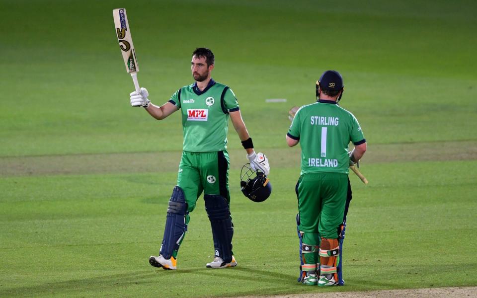Ireland's captain Andy Balbirnie celebrates his half century with Paul Stirling - REUTERS