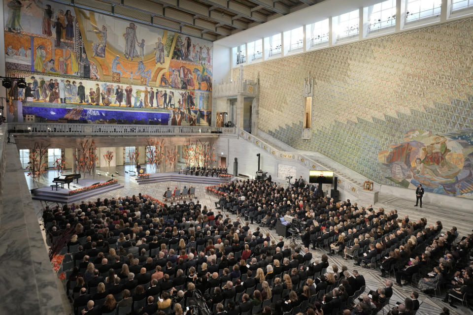 An overview of the Nobel Peace Prize ceremony at Oslo City Hall, Norway, Saturday, Dec. 10, 2022. This year's Nobel Peace Prize was shared by jailed Belarus rights activist Ales Bialiatski, the Russian group Memorial and the Center for Civil Liberties in Ukraine. The Norwegian Nobel Committee said the laureates "have made an outstanding effort to document war crimes, human right abuses and the abuse of power. Together they demonstrate the significance of civil society for peace and democracy." The prize was seen as a strong rebuke to the authoritarian rule of Putin. (AP Photo/ Markus Schreiber)