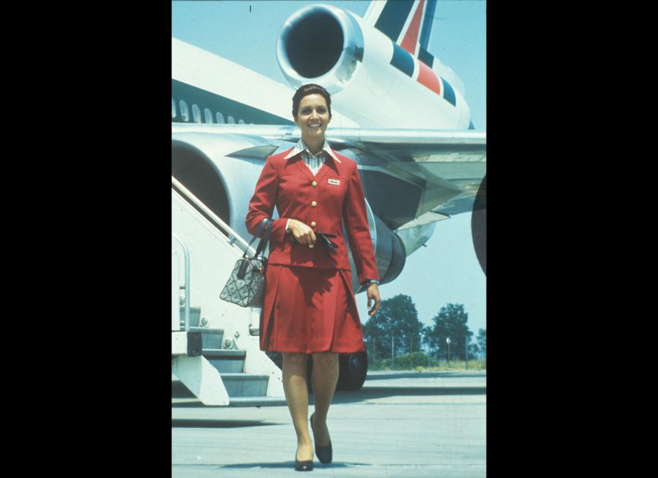 Florence Marzotto designs the Alitalia uniform choosing pomegranate red through the 70s and transitioning to green blazers and sweaters paired with navy skirts in the 80s.  She designs the skirt to once again fall below the knee. 