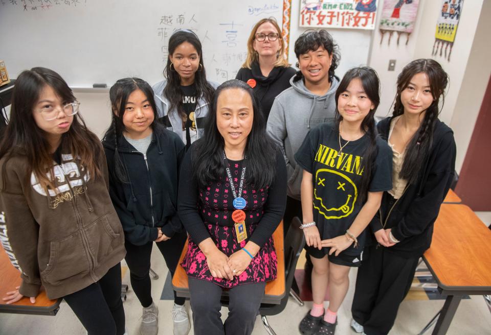 Chavez High School Chinese teachers Qing Wang, center front, and Ellena Gibbons, center rear, surrounded by students Athena Guro, left, Risa Vang, Jazelle Coleman, Skyler Hong, Sreyka Koch and Ailily Kim.