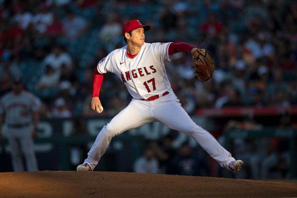 Shohei Ohtani #17 of the Los Angeles Angels pitches against the Houston Astros at Angel Stadium of Anaheim on July 13, 2022 in Anaheim, California.