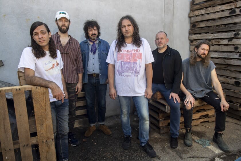 BURBANK, CA - October 05 2021: The War on Drugs band members, left to right, Anthony LaMarca, David Hartley, Charlie Hall, Adam Granduciel, Jon Natchez and Robbie Bennett sit for portraits on Tuesday, Oct. 5, 2021 in Burbank, CA. (Brian van der Brug / Los Angeles Times)