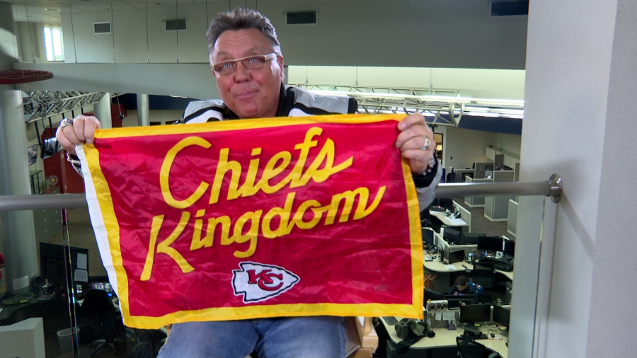 <em>Local labor leader Tommy White holds up the Chiefs flag supposedly buried under Allegiant Stadium. (KLAS)</em>