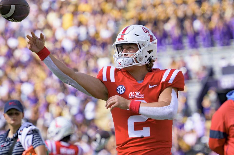 Mississippi quarterback Jaxson Dart (2) warms up before an NCAA college football game against LSU in Baton Rouge, La., Saturday, Oct. 22, 2022. (AP Photo/Matthew Hinton)