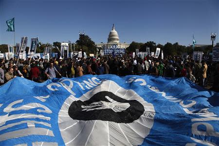 Demonstrators hold a parachute as they protest during the "Stop Watching Us: A Rally Against Mass Surveillance" near the U.S. Capitol in Washington, October 26, 2013. REUTERS/Jonathan Ernst