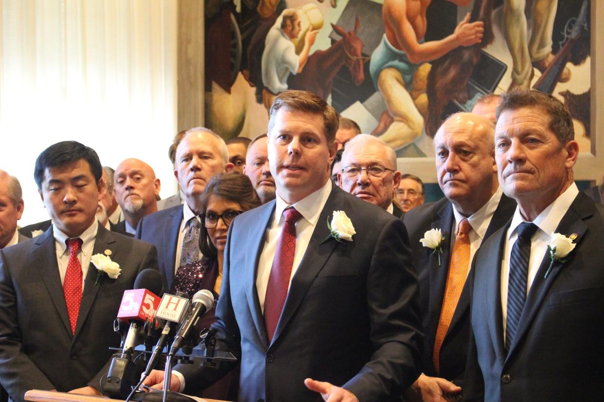 Missouri Speaker of the House Dean Plocher, center, speaks to reporters in Jefferson City on Jan. 4, 2023.