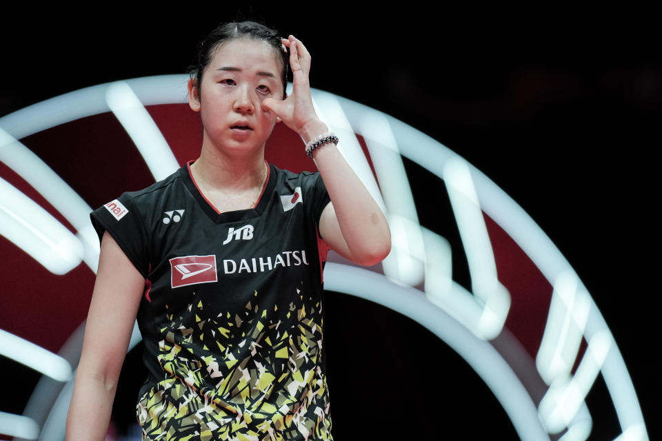 HANGZHOU, CHINA - DECEMBER 14: Wakana Nagahara of Japan gets an injury in the Women's Doubles Round Robin match against Tan Ning and Liu Shengshu of China during day two of the BWF World Tour Finals 2023 at Hangzhou Olympic Sports Centre Stadium on December 14, 2023 in Hangzhou, China. (Photo by Shi Tang/Getty Images)