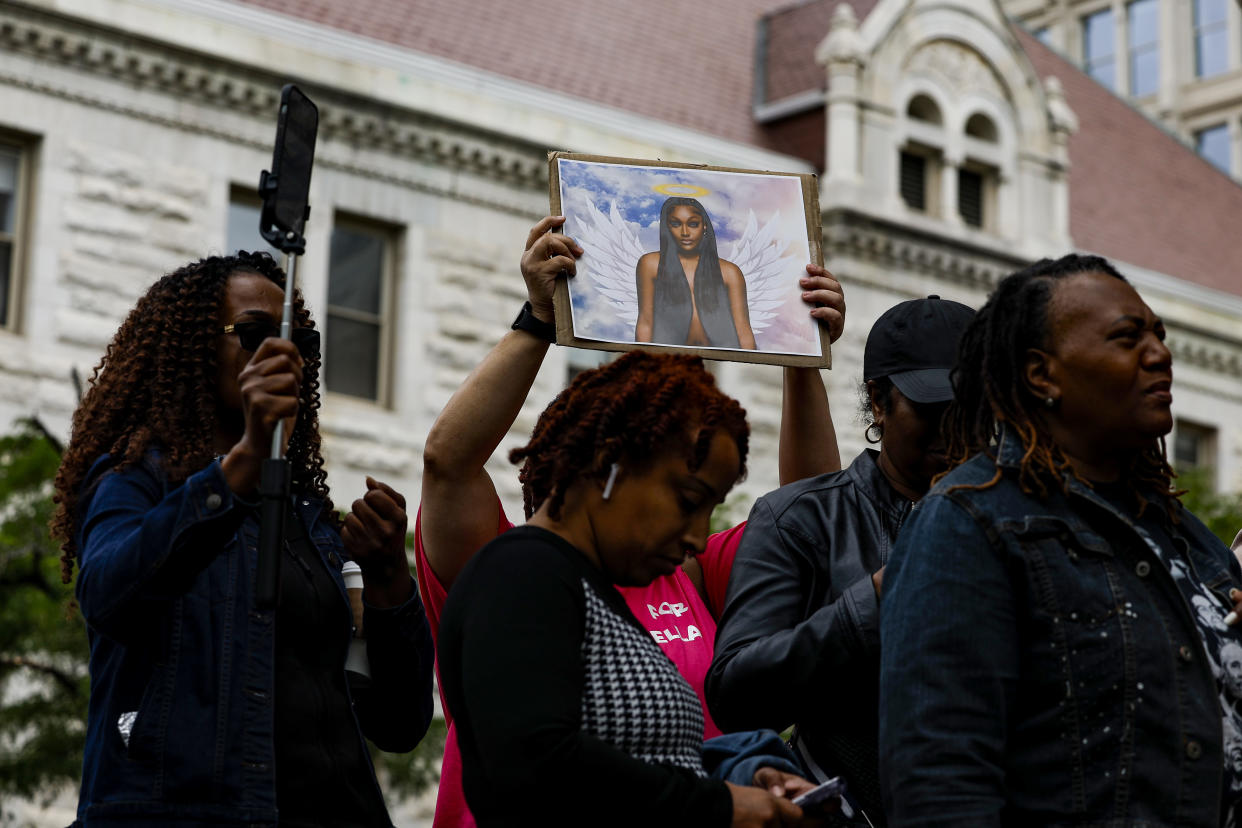 An activist holds up a picture of Shanquella Robinson during a press conference on Friday in Washington, D.C., on the investigation into her killing.