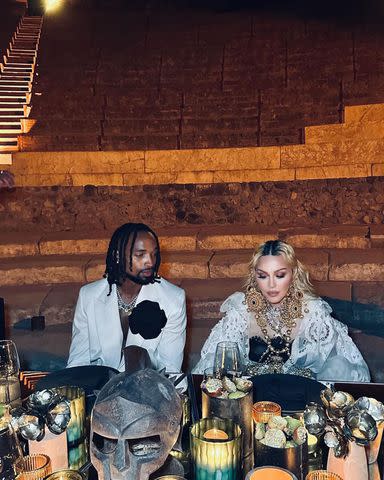 <p>Ricardo Gomes</p> Madonna and Morris seated at the table in Pompei