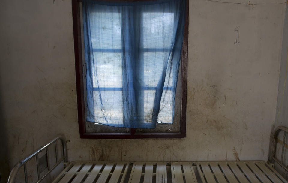 In this Jan. 17, 2014 photo, an empty bed at Dapaing Village Hospital is seen in north of Sittwe, Rakhine State, Myanmar. Data on Rohingya health is almost nonexistent. However, Rakhine is the nation's second-poorest state and lives have always been at greater risk there. Away from the camps, in isolated and predominantly Muslim northern Rakhine state, the health situation is even worse and reaching a hospital is nearly impossible. (AP Photo/Gemunu Amarasinghe)