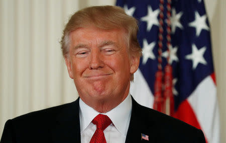 FILE PHOTO: U.S. President Donald Trump smiles during the introduction of his Secretary of Homeland Security nominee Kirstjen Nielsen in the East Room of the White House in Washington, U.S., October 12, 2017. REUTERS/Kevin Lamarque/File Photo