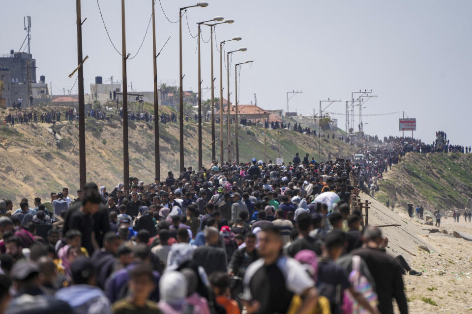 Displaced Palestinians trying to walk back from central Gaza Strip to northern Gaza Strip , Sunday, April 14, 2024. (AP Photo/Abdel Kareem Hana)