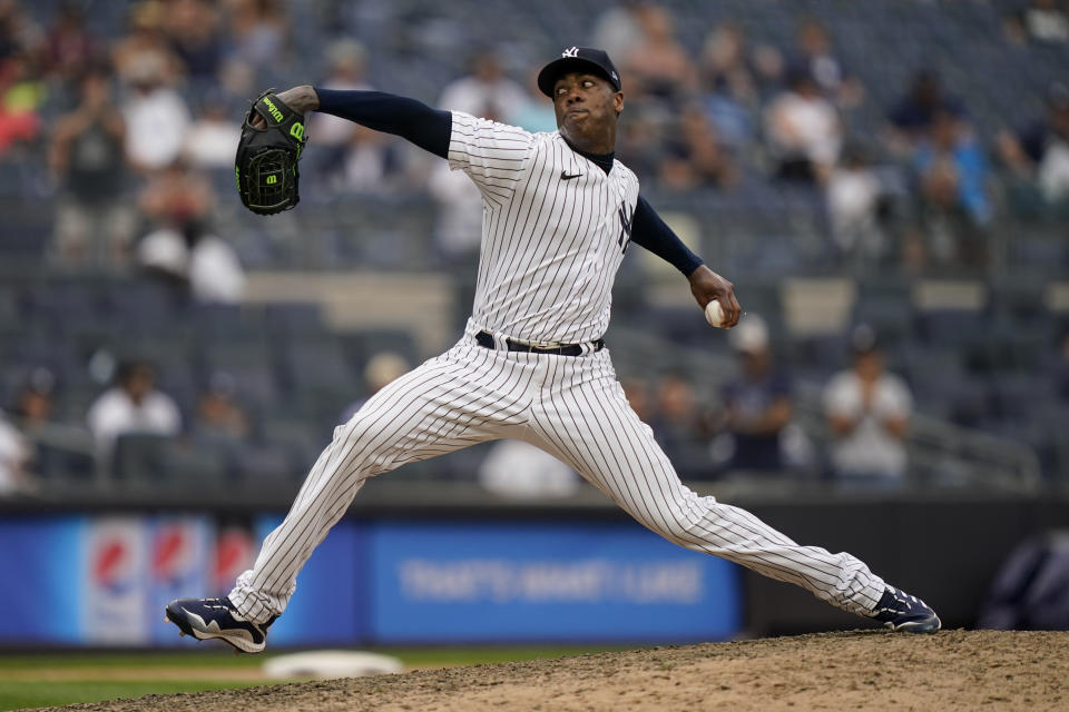 New York Yankees relief pitcher Aroldis Chapman throws in the ninth inning of a baseball game against the Oakland Athletics, Saturday, June 19, 2021, in New York. (AP Photo/John Minchillo)