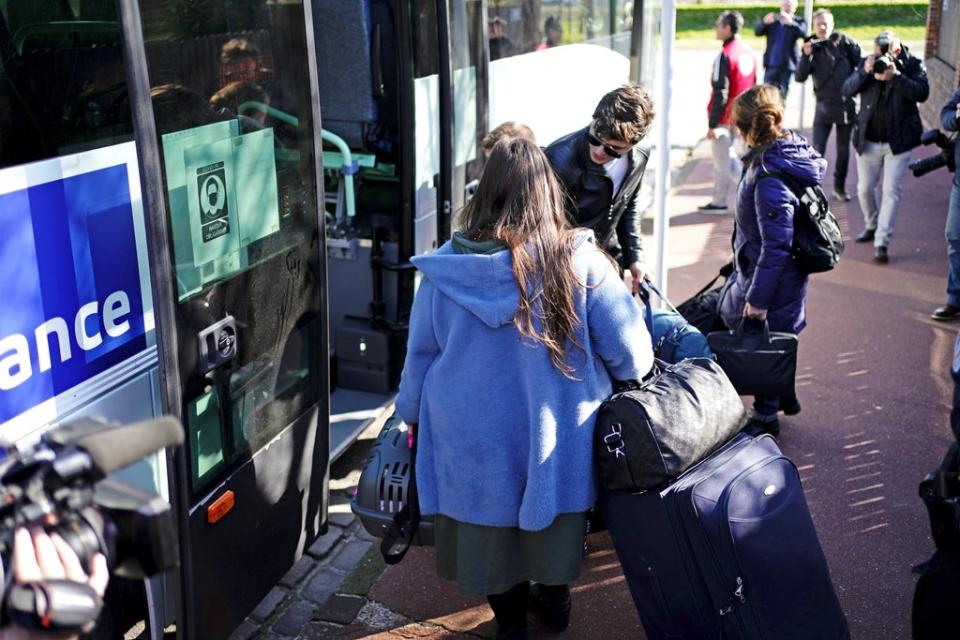 Ukrainian refugees load their belongings on to a bus before it leaves Calais (Aaron Chown/PA) (PA Wire)