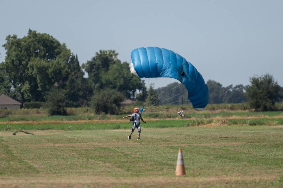 A skydiver lands in the field at the Parachute Center skydiving facility at the Lodi Airport on Sept. 7, 2023.