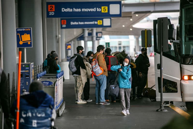 FILE PHOTO: Passengers wait for the resumption of flights at O'Hare International Airport