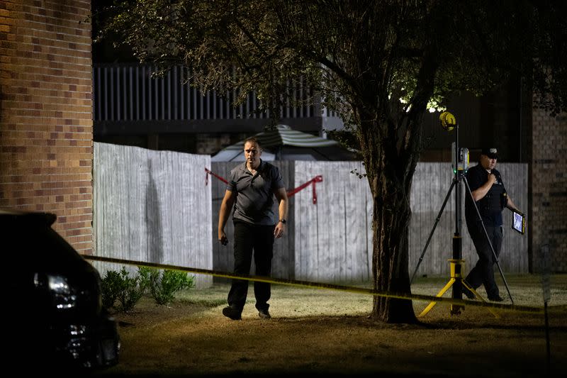 Investigators examine the scene in Lacey, Washington where law enforcement officers reportedly shot and killed Michael Forest Reinoehl