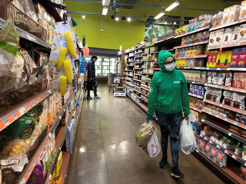 FILE PHOTO: Shoppers are seen at Whole Foods in Los Angeles, California