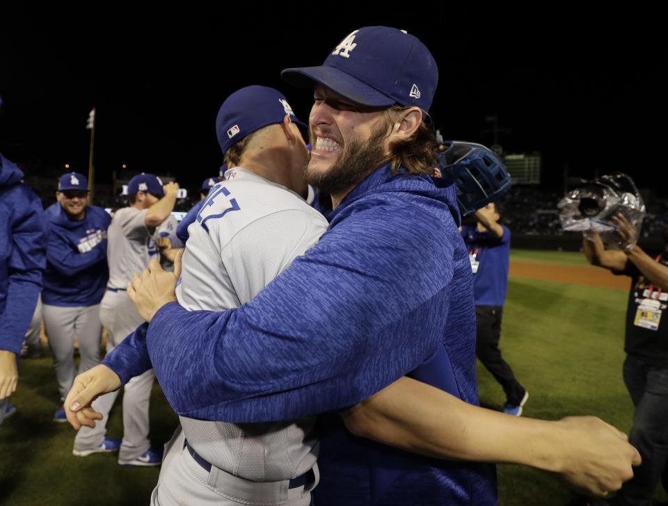 Enrique Hernandez and Clayton Kershaw celebrate after Game 5 of the NLCS to advance to the World Series. (AP)