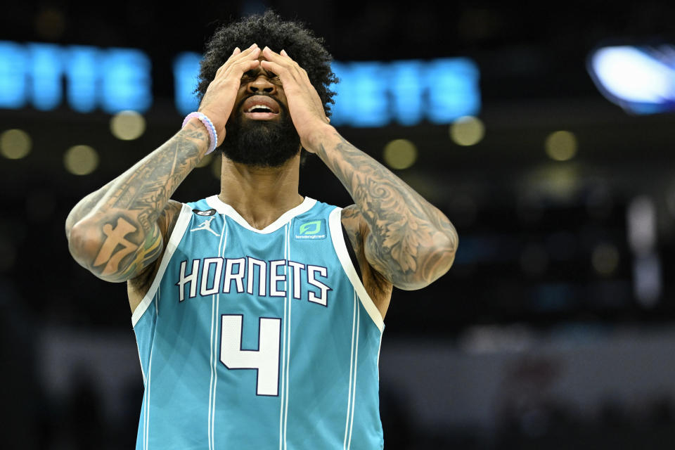 Charlotte Hornets center Nick Richards (4) puts his hands over his face after being called for a foul during the second half of an NBA basketball game against the Indiana Pacers, Monday, March 20, 2023, in Charlotte, N.C. (AP Photo/Matt Kelley)