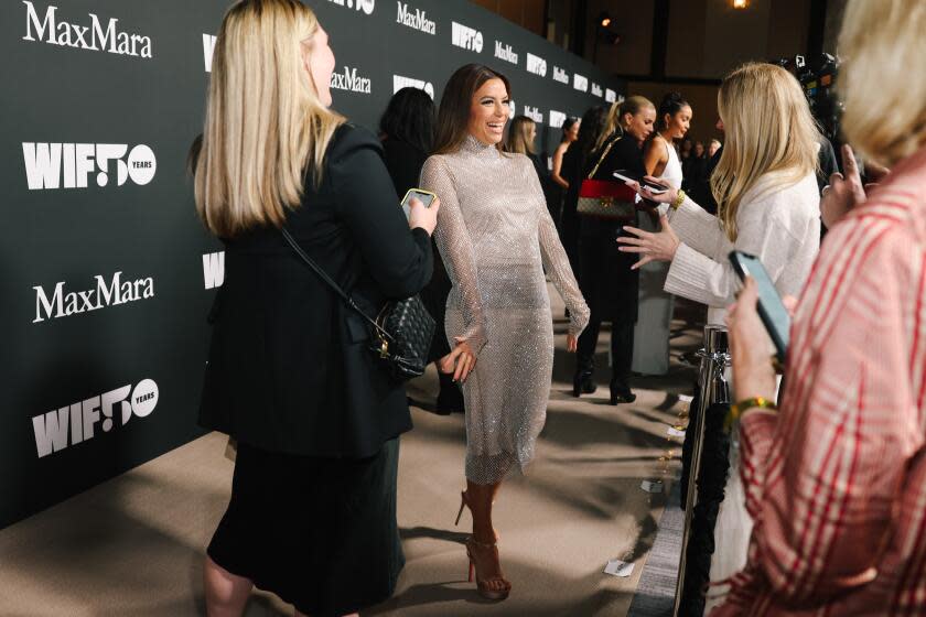 Los Angeles, CA - November 30: Eva Longoria speaks to the press on the red carpet at the WIF annual gala at Dolby Theater on Thursday, Nov. 30, 2023 in Los Angeles, CA. This year's WIF Honors will celebrate WIF's 50th anniversary of fighting for gender equity in Hollywood. (Dania Maxwell / Los Angeles Times)