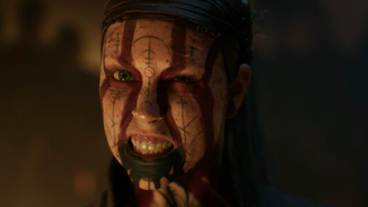  A close-up of Senua baring her teeth. 