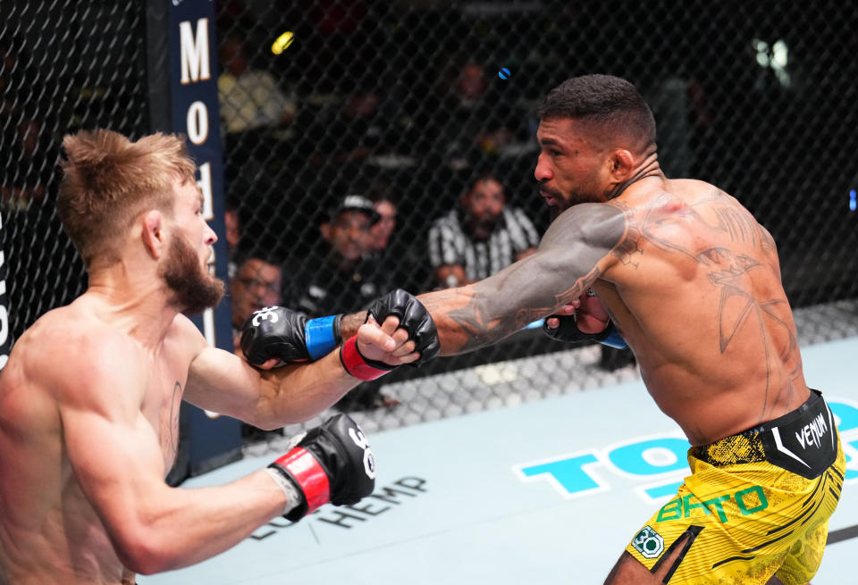 LAS VEGAS, NEVADA – NOVEMBER 18: (R-L) Joanderson Brito of Brazil punches Jonathan Pearce in a featherweight fight during the UFC Fight Night event at UFC APEX on November 18, 2023 in Las Vegas, Nevada. (Photo by Chris Unger/Zuffa LLC via Getty Images)