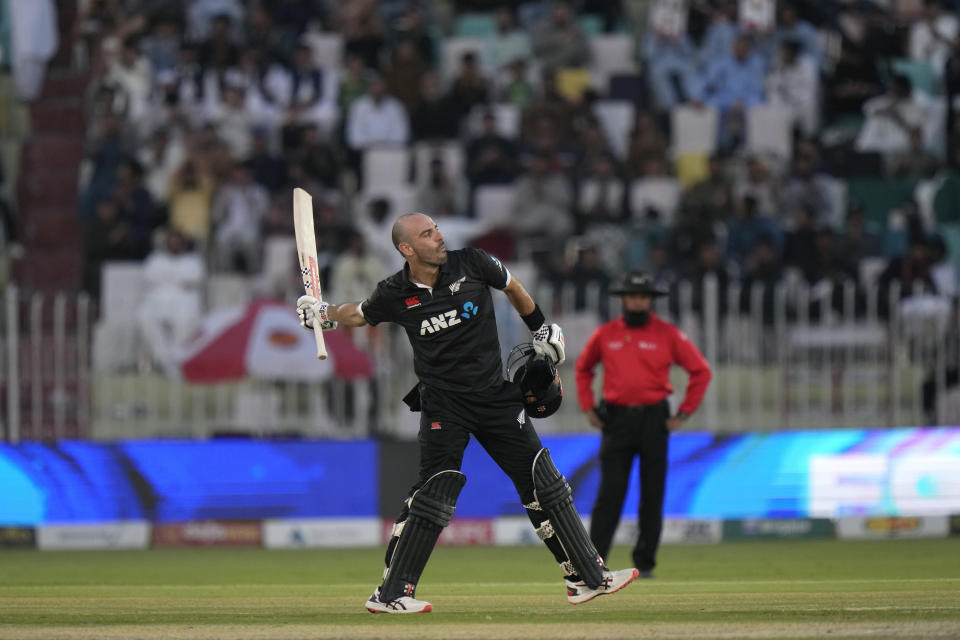 New Zealand's Daryl Mitchell celebrates after scoring century during the first one-day international cricket match between Pakistan and New Zealand, in Rawalpindi, Pakistan, Thursday, April 27, 2023. (AP Photo/Anjum Naveed)